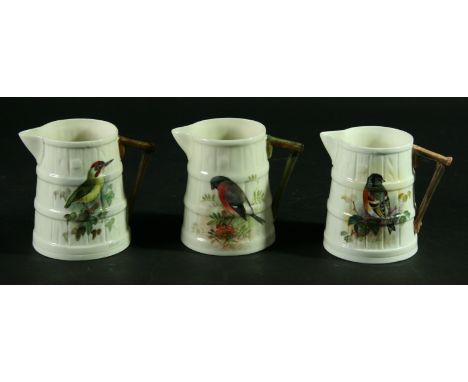 THREE ROYAL WORCESTER JUGS, signed Powell and Allen, date cipher 1919 and later, painted with a Brambling, Green Woodpecker a