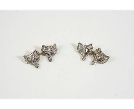 A PAIR OF DIAMOND FOX MASK CUFFLINKS each set overall with circular-cut diamonds, with ruby eyes, in gold.