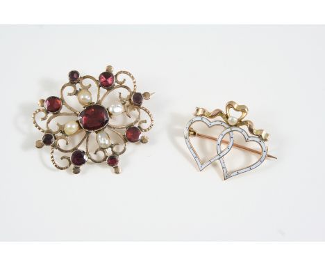 A GEORGIAN GARNET AND PEARL SET BROOCH the gold openwork brooch is centred with an oval-shaped garnet, with circular-cut garn
