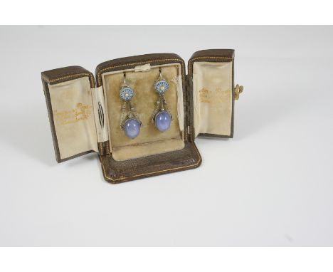 A PAIR OF STAR SAPPHIRE, DIAMOND AND ENAMEL DROP EARRINGS each set with an oval cabochon star sapphire, with rose-cut diamond