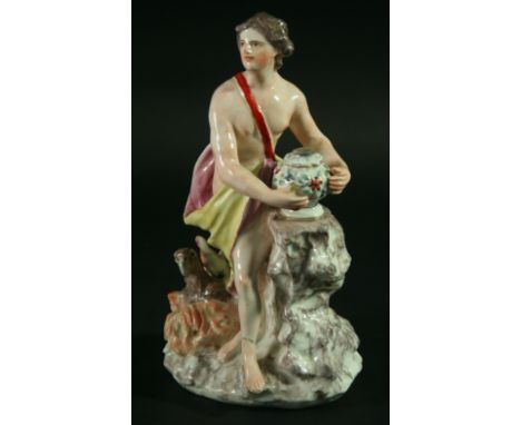 AN ENGLISH PORCELAIN FIGURE, 18th century, possibly Bow, allegorical of Winter, a maiden standing next to an urn, a phoenix a