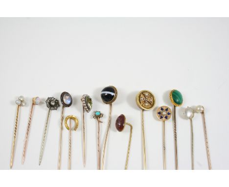 FOURTEEN ASSORTED GOLD AND GEM SET STICK PINS including one set with a circular banded agate cabochon, a turquoise and pearl 