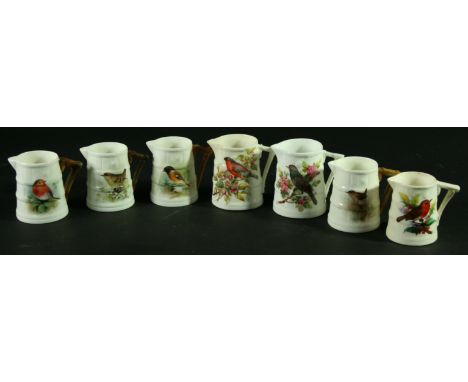 A COLLECTION OF SEVEN ROYAL WORCESTER JUGS, some signed Nicholls, Allen or Jones, date ciphers for 1878 and later, painted wi