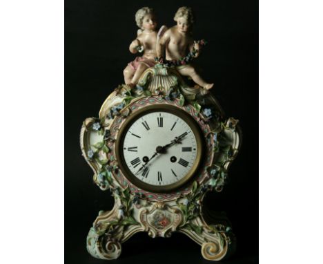 A MEISSEN STYLE PORCELAIN CLOCK probably late 19th Century with enamel dial on a brass movement, the floral-encrusted case su