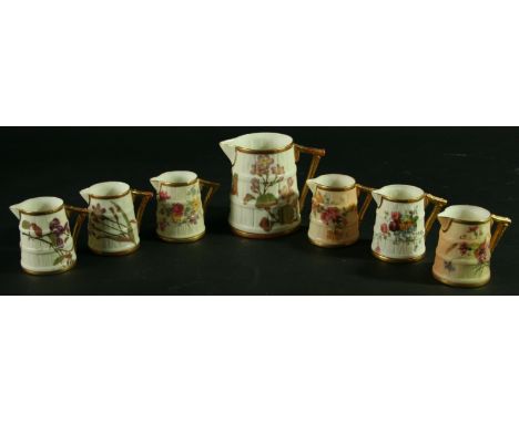 A COLLECTION OF SEVEN ROYAL WORCESTER RUSTIC JUGS, 1892 and later, each decorated with meandering floral sprays, green printe