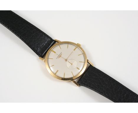 A GENTLEMAN'S GOLD WRISTWATCH BY LONGINES the signed circular dial with baton numerals and subsidiary seconds dial, with pres