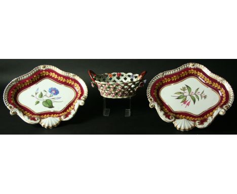 A PAIR OF CHAMBERLAINS WORCESTER BOTANICAL DISHES central floral specimen inside a burgundy and gilt rim, iron red painted ma