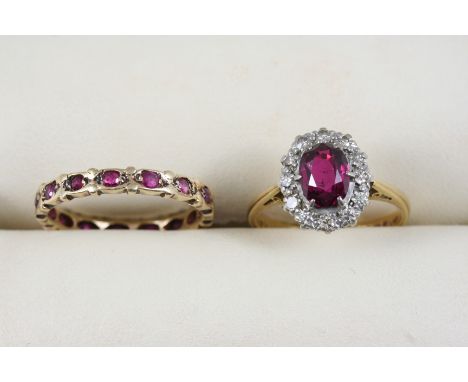A RUBY AND DIAMOND CLUSTER RING the oval-shaped ruby is set within a surround of eight-cut diamonds, in 18ct. gold, size L, t