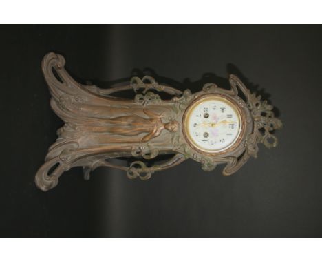 ART NOUVEAU MANTLE CLOCK a large mantle clock in the Art Nouveau style, the metal case with a lady in the centre and a floral