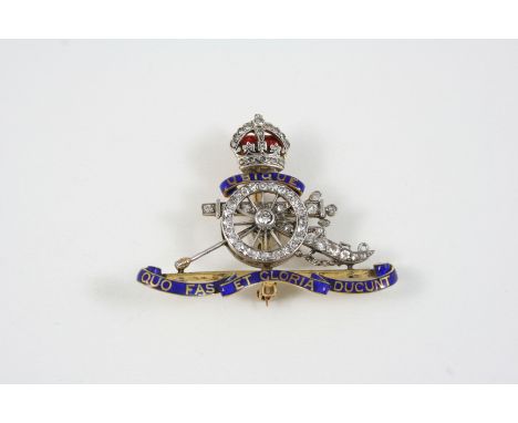 A DIAMOND AND ENAMEL REGIMENTAL BROOCH FOR THE ROYAL ARTILLERY set with rose-cut diamonds, and with red and blue enamel decor