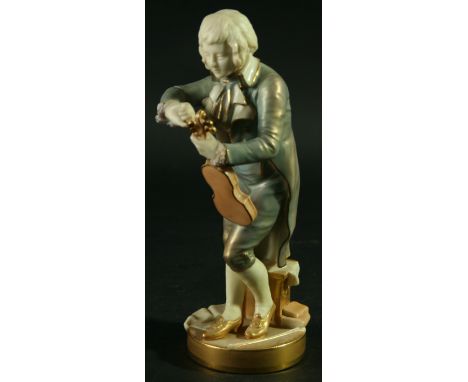 A ROYAL WORCESTER FIGURE OF THE YOUNG MOZART, model 1847, date cipher for 1931, in a pale blue jacket, puce printed marks, 22