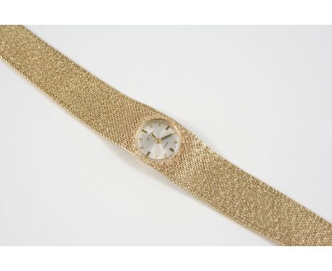 A LADY'S 9CT. GOLD WRISTWATCH BY ROTARY the signed circular dial with baton numerals, on an integrated gold mesh bracelet, 45