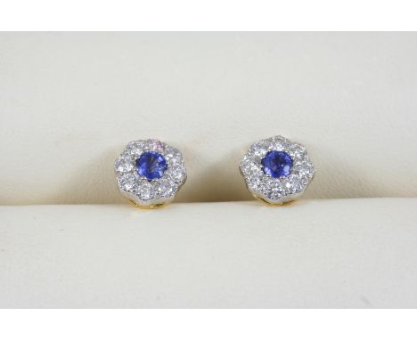 A PAIR OF SAPPHIRE AND DIAMOND CLUSTER STUD EARRINGS each centred with a circular-cut sapphire within a surround of eight cir