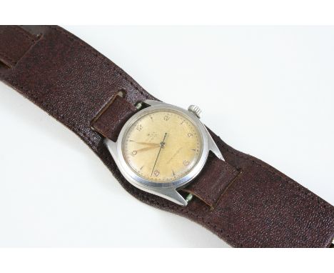 A STAINLESS STEEL OYSTER SHOCK RESISTING WRISTWATCH BY ROLEX the signed circular dial with Arabic and dagger numerals, 35mm.,