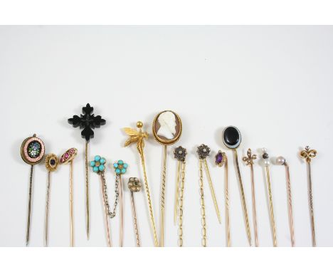 FIFTEEN ASSORTED GOLD AND GEM STICK PINS including one mounted with an oval shell cameo of a bearded gentleman, one set with 