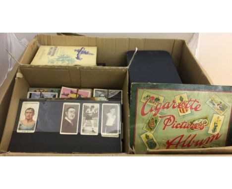 A large quantity of cigarette cards and albums