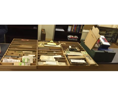 A quantity of part-made brass rolling stock and train kits; together with model making tools