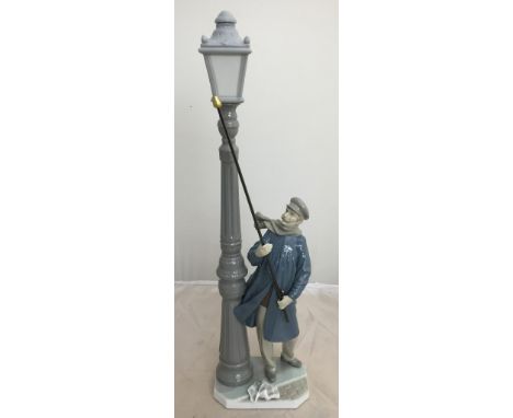  A Lladro figure lamp lighter