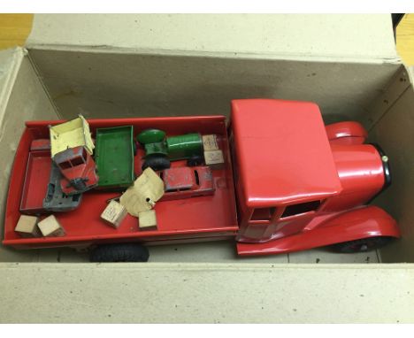 A large vintage Tri-Ang tipper truck; together with smaller cars/tractor