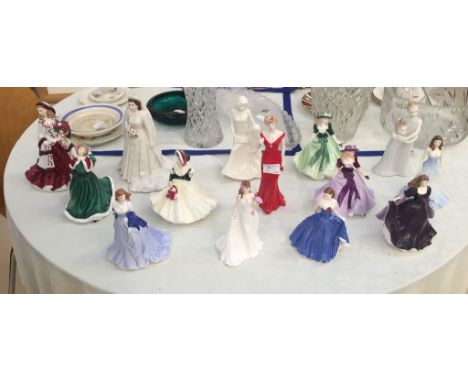 A collection of 14 Royal Doulton and Royal Worcester figurines