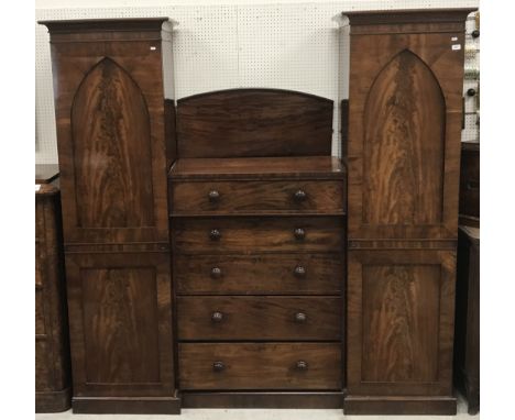 A Victorian mahogany breakfront wardrobe, the centre section with drawer over a fall front compartment as two drawers, openin