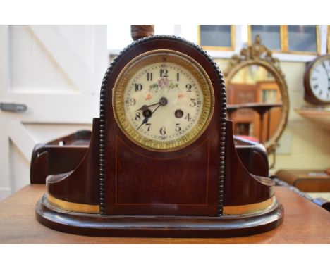 An Edwardian mahogany mantel clock,&nbsp;24.5cm high, with pendulum.&nbsp; 