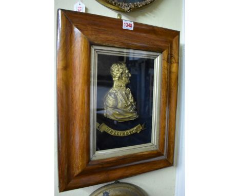 A gilt brass portrait profile plaque of The Duke of Wellington,&nbsp;in a rosewood frame, the whole 44 x 36.5cm.&nbsp; 