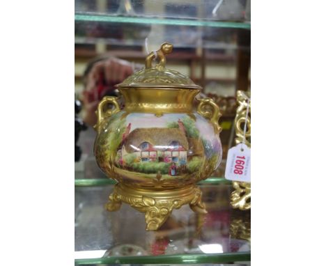 A Royal Worcester twin handled vase and cover,&nbsp;circa 1926, painted with a thatched cottage in a continuous landscape, 19