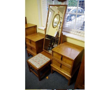 A Gordon Russell oak mirror back dressing table and stool,&nbsp;136cm wide.Provenance: This was a wedding present to the vend