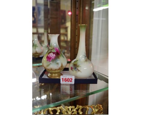 Two small Royal Worcester vases,&nbsp;circa 1912 and 1914, each painted with roses, largest 13cm high. 