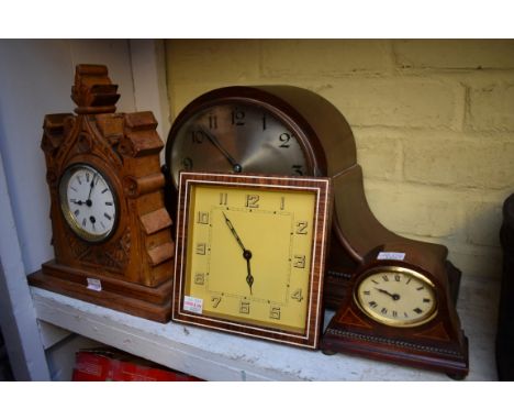 A 1920s mahogany mantel clock, 54cm wide; together with three other timepieces.&nbsp; 