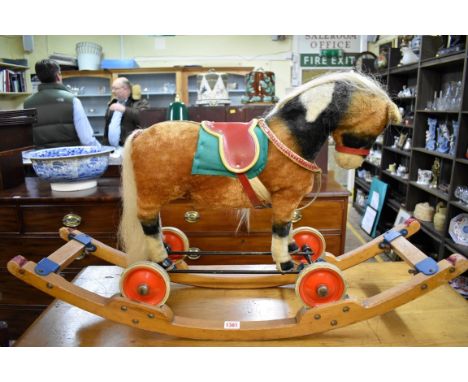 A circa 1950s/60s Steiff riding pony on wheels, original label numbered 1343,21, with pull cord voice box, on additional Stei
