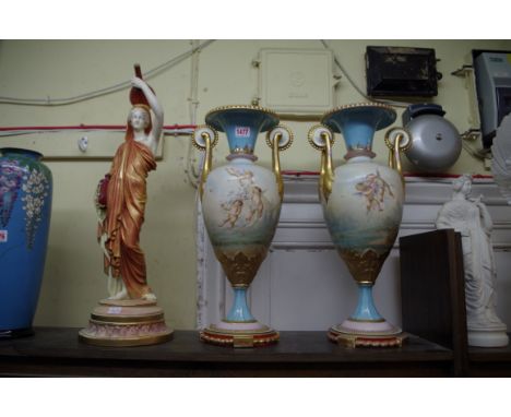 A large pair of Vienna style porcelain twin handled vases,&nbsp;each painted with cherubs, 47.5cm high, (restored); together 