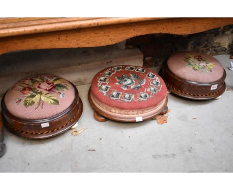 A pair of Victorian walnut and chequer strung circular foot stools, together with another Victorian circular foot stool. (3)&
