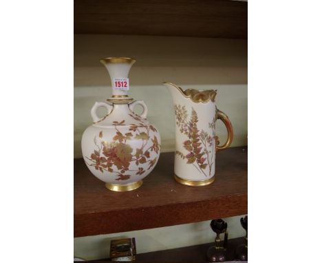 A Royal Worcester twin handled vase,&nbsp;26cm high; together with a similar tusk jug, 21.5cm high.&nbsp; 