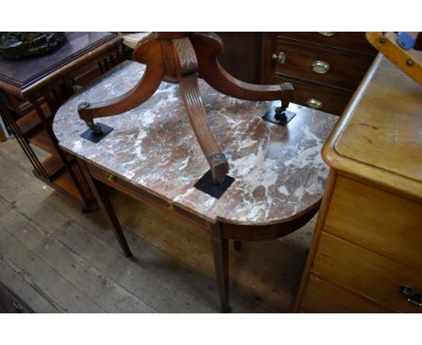 An Edwardian and mahogany marble top console table,&nbsp;107.5cm wide. 