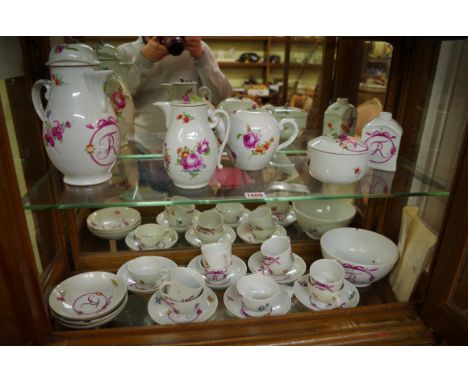 A late 18th/early 19th century Volkstedt porcelain tea service, comprising: a large pot and cover, 22cm high; a tea pot and c