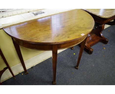 A pair of circa 1900 mahogany demi lune console tables,&nbsp;106.5cm wide. 