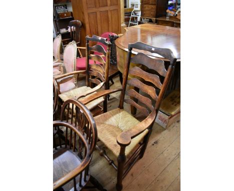 A 19th century ash and rush seat ladder back rocking chair;&nbsp;together with another 19th century ash and beech ladder back