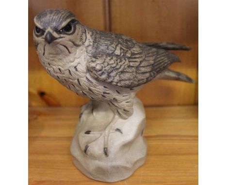 A painted cast Poole pottery model of Merlin 