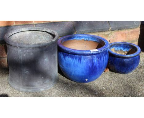 A lead effect cylindrical planter, together with two blue glazed stoneware planters 