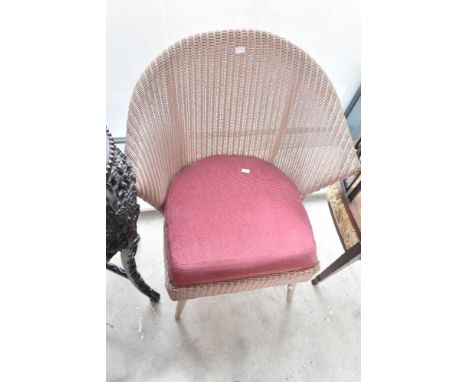 A Lloyd Loom tub chair