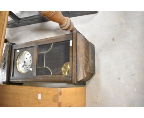 A 1920s/1930s oak cased wall clock
