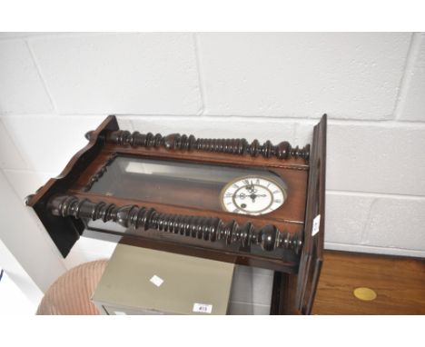 A 19th Century mahogany cased wall clock , roman numeral dial