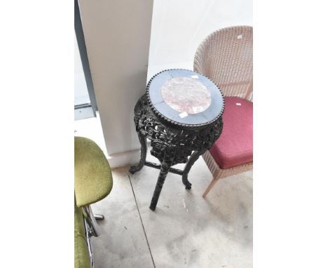 An Oriental style plant stand having rouge marble top, height approx. 77cm