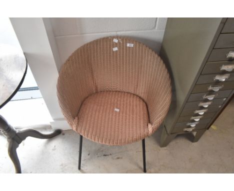 A vintage metal framed Lloyd Loom chair