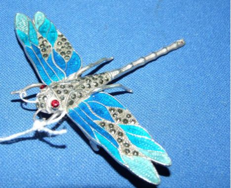 A silver and enamel dragonfly brooch Condition report Report by NG

Wing span approx. 83 mm, height approx. 64 mm.