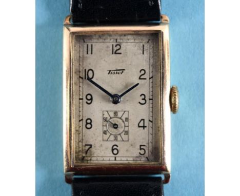A gentleman's 9ct gold Tissot wristwatch, the rectangular silvered dial having Arabic numerals and subsidiary seconds dial  S