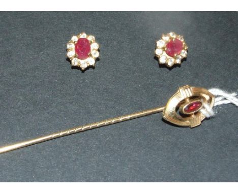 A pair of yellow coloured metal, ruby and diamond cluster stud earrings, and a yellow coloured metal and ruby stick pin (2)