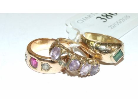 A yellow coloured metal, ruby and diamond gypsy style ring, two other rings (3)